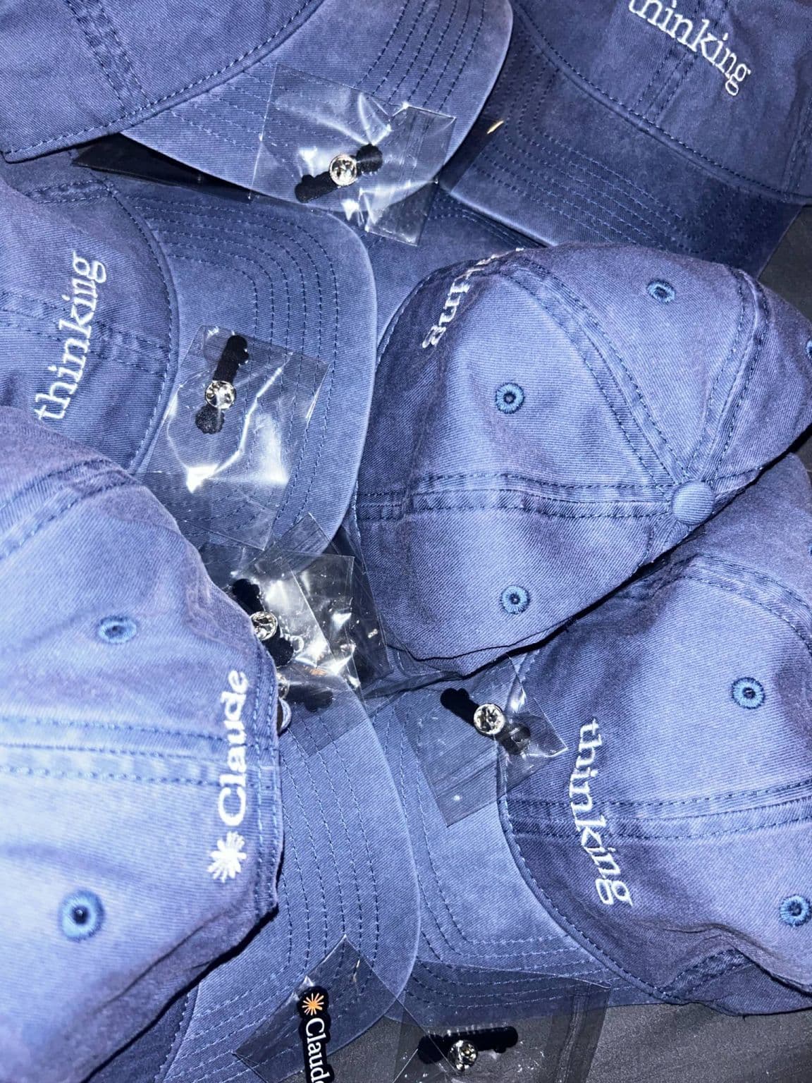 Claude Builder Club members wearing Claude hats